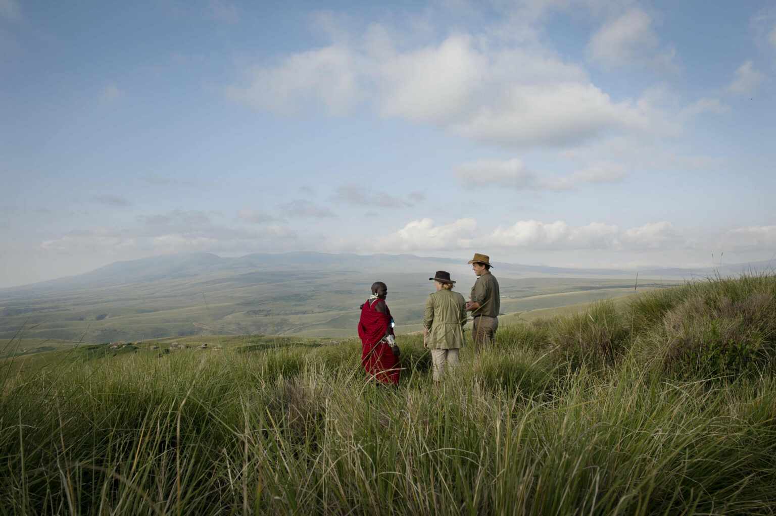 Two guests with a Masaai Guide looking at the view in the Ngorongoro Highlands
