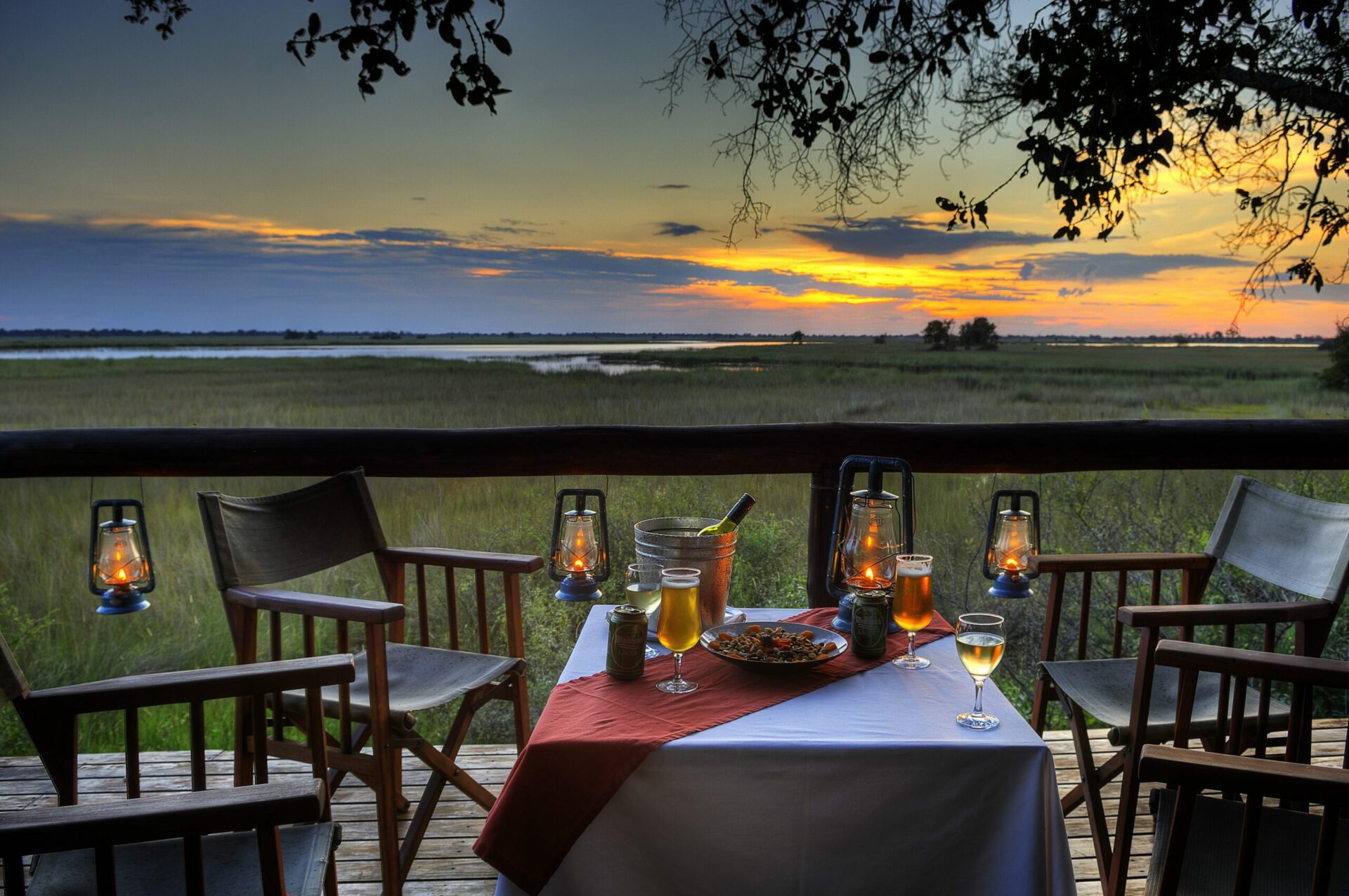 sunset at camp moremi with deck view and drinks on our best Botswana safari