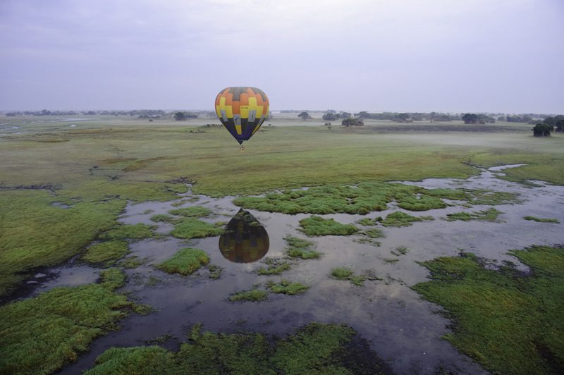 balloon gliding over swamps at shumba camp in kafue