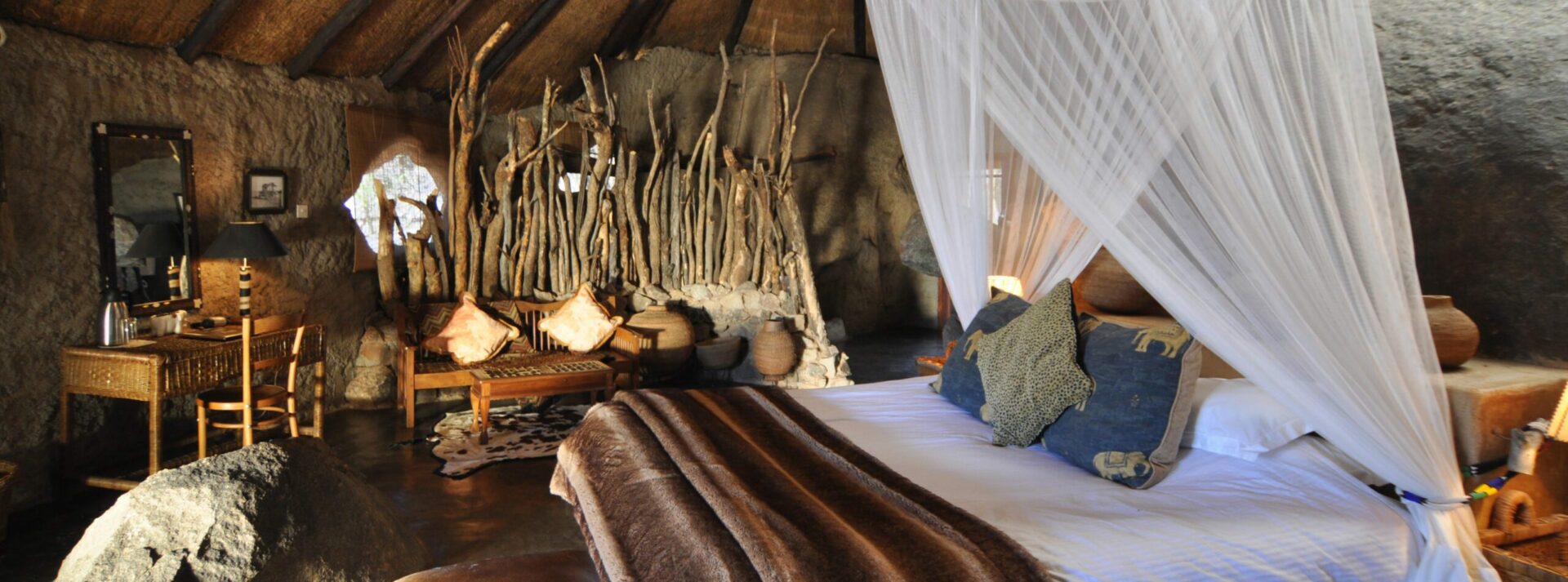 stay in this bedroom built into the rocks at Amalinda in Matobo HIlls on our Zimbabwe safari