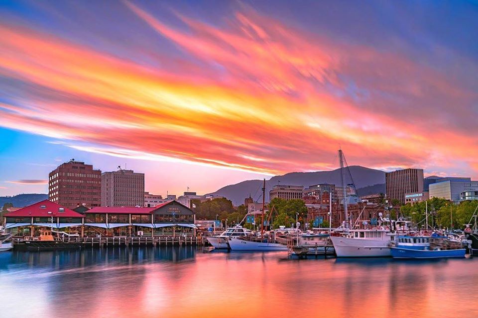 Vibrant and colorful sunset over Hobart, the Derwent River, and Mt. Wellington on Australia self-drive tour