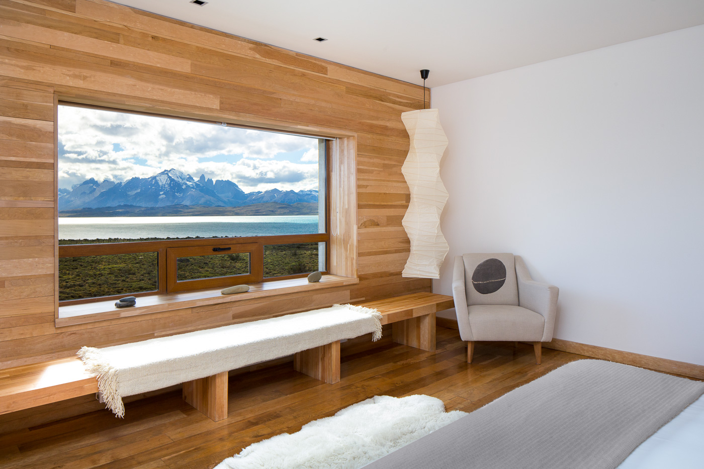 Interior room of Tierra Patagonia looking outside the window at the mountains