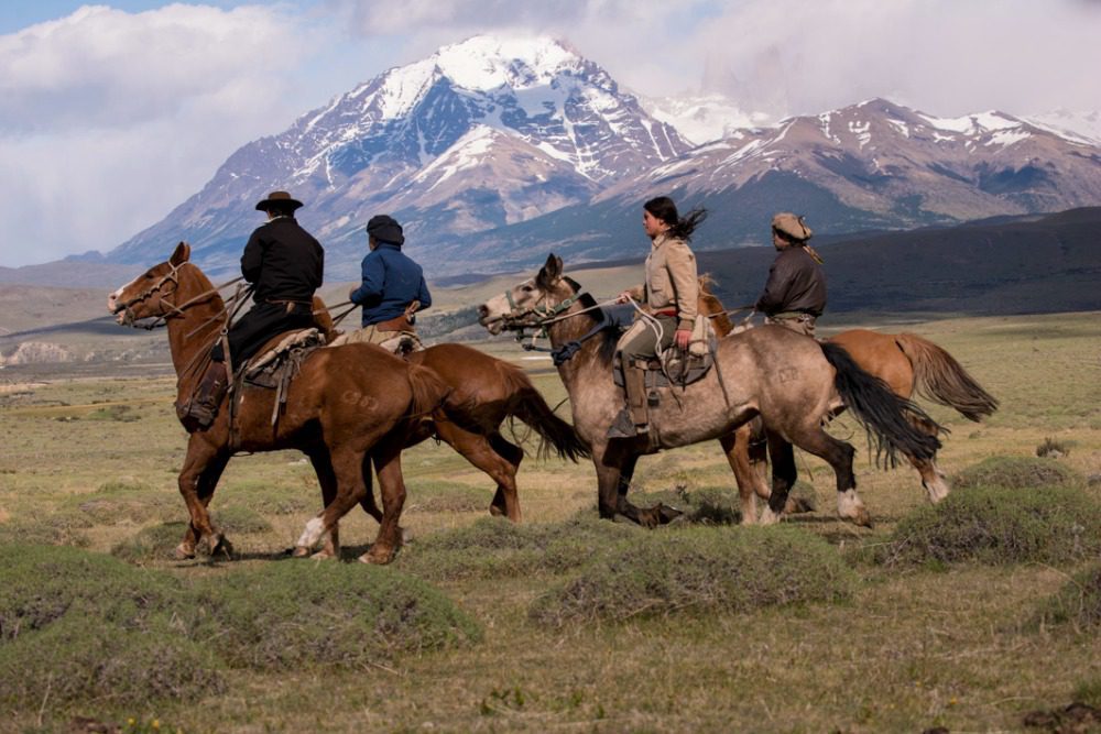 Plan your Trip, Gauchos on horseback riding through Torres del Paine. Awasi is a luxury hotel in patagonia on Argentina & Chile tour