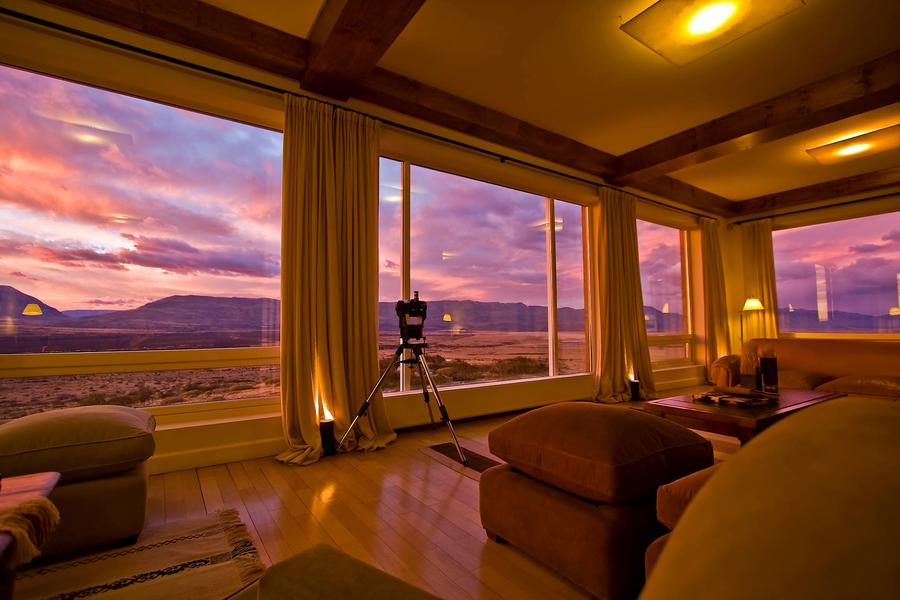 The 5 Best Luxury Patagonia Properties for Your Adventure, Cozy Living Room with Glow of Beautiful Sunset 