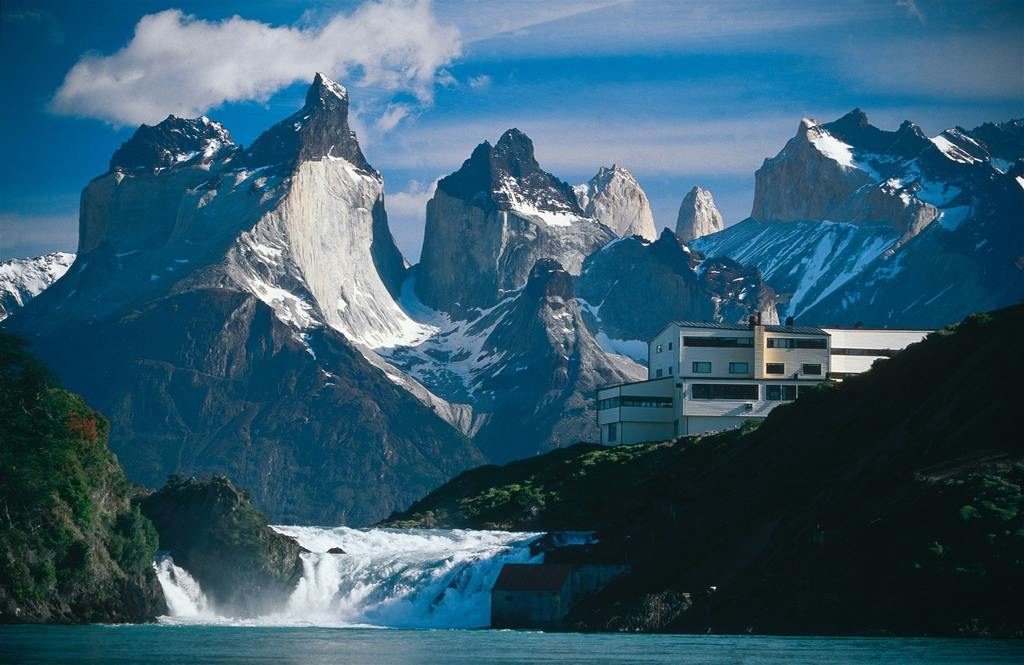 The dramatic peaks of Torres del Paine with gushing water below