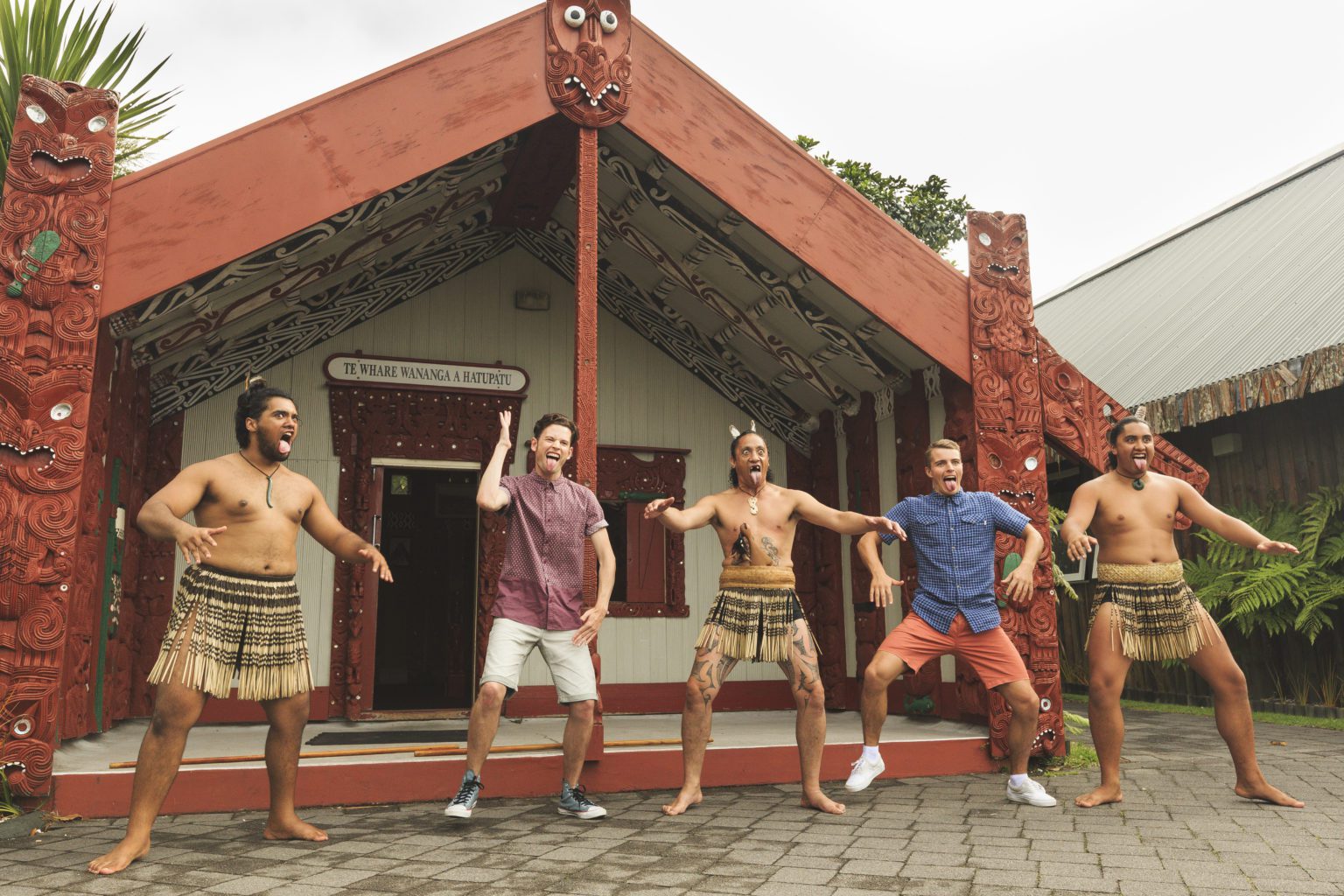 Tourists doing the Haka with some Maori guys at Te Puia