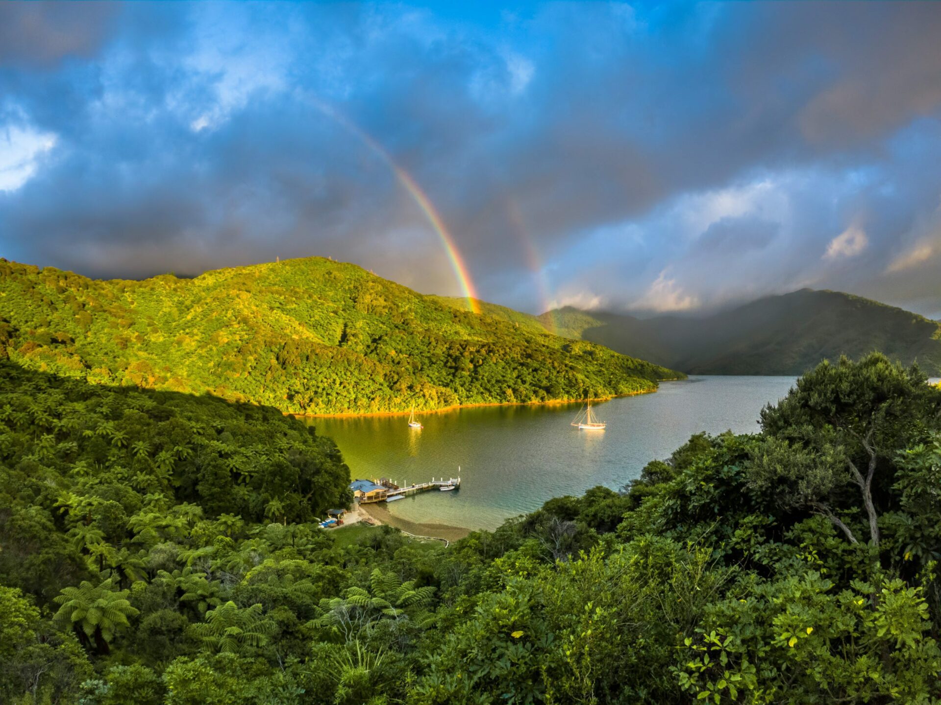 A rainbow over the mountains and sea in Marlborough Sounds.