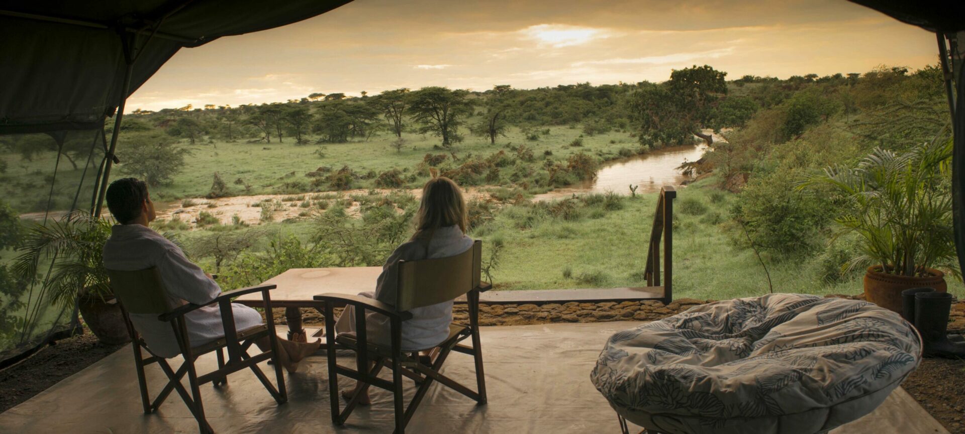 Protecting Kenya: A Luxury Conservation Safari. View from the honeymoon suite at Richard's RIver Camp at sundown on a luxury kenya safari