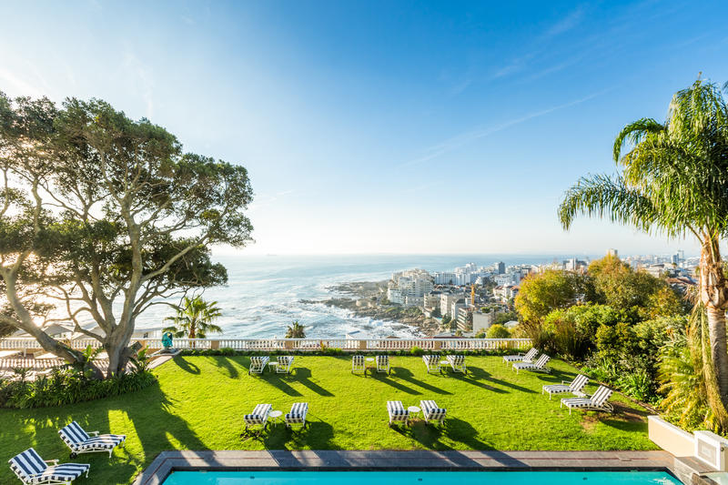View over the pool and lawns of Ellerman House to the Atlantic Ocean