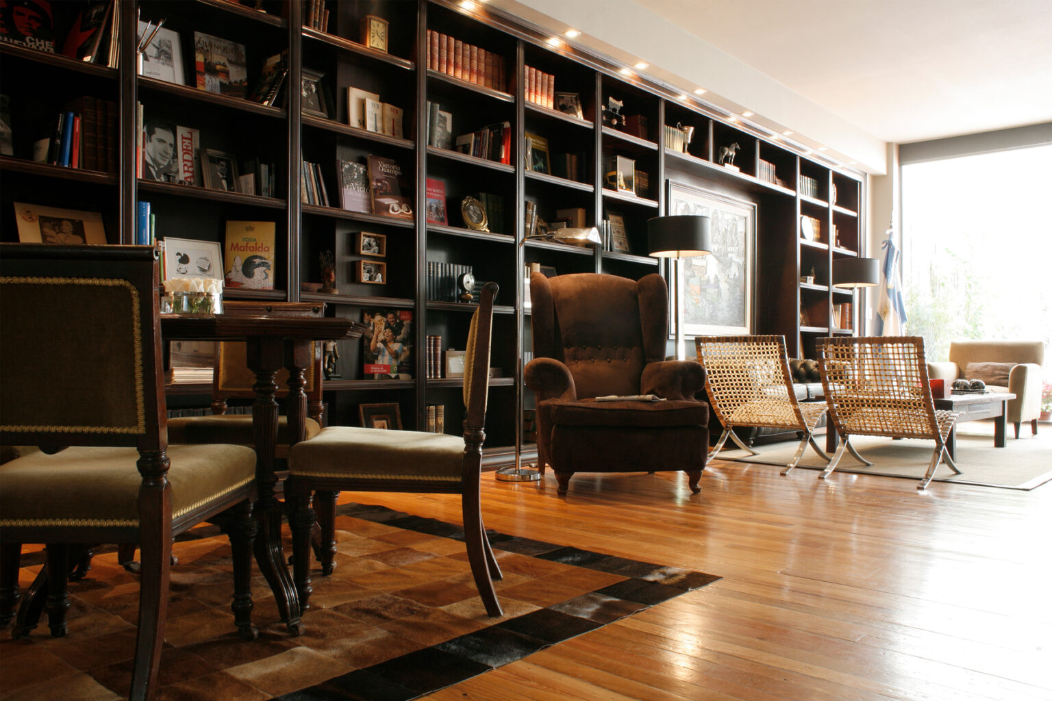 Hotel lobby with bookshelves and seating