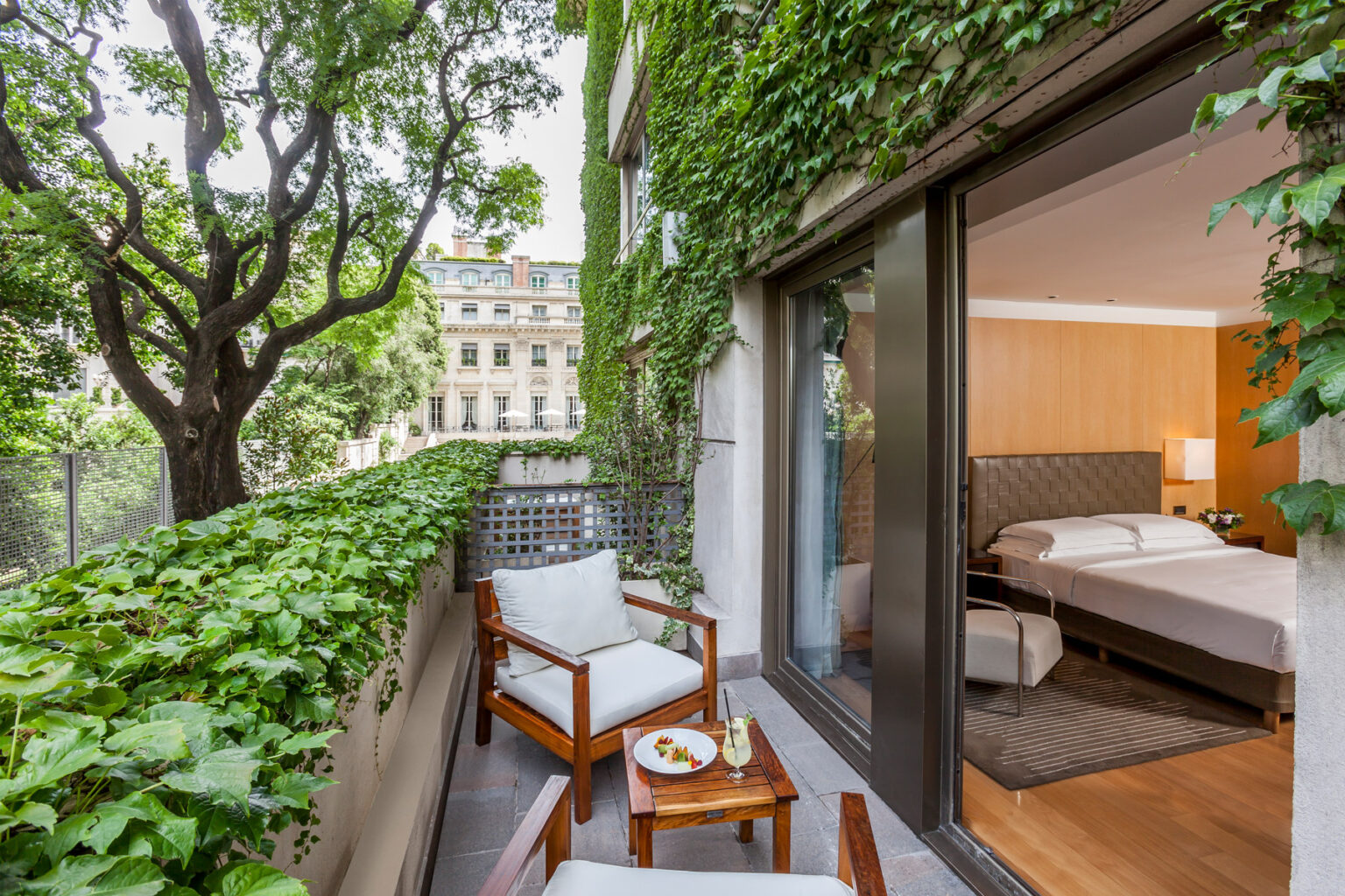 Hotel room balcony surrounded by trees