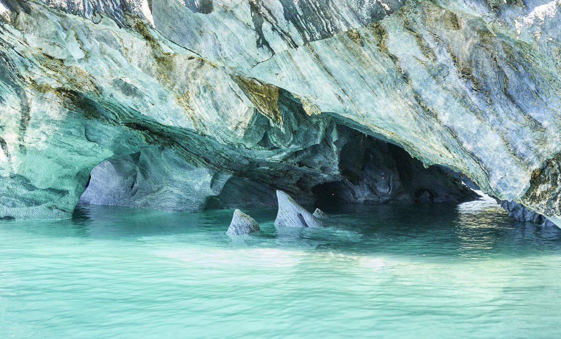 light turquoise water and marble rock
