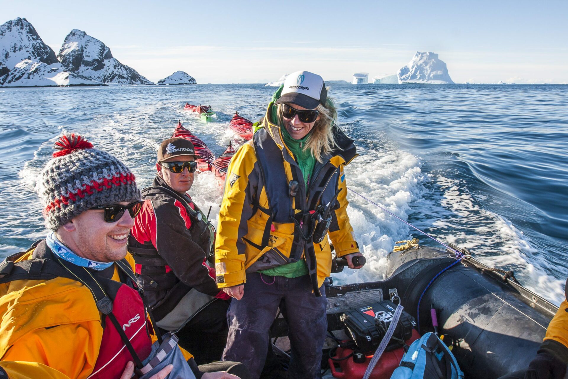 smiling guests on a zodiac cruise in Antarctica