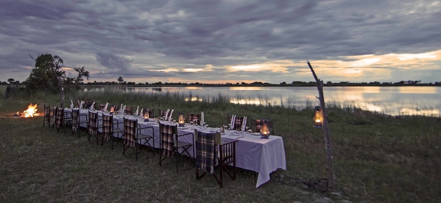 shinde camp bush dinner by the water seen on our Botswana safari