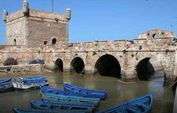 Essaouira harbor and fortress with blue fishing boats