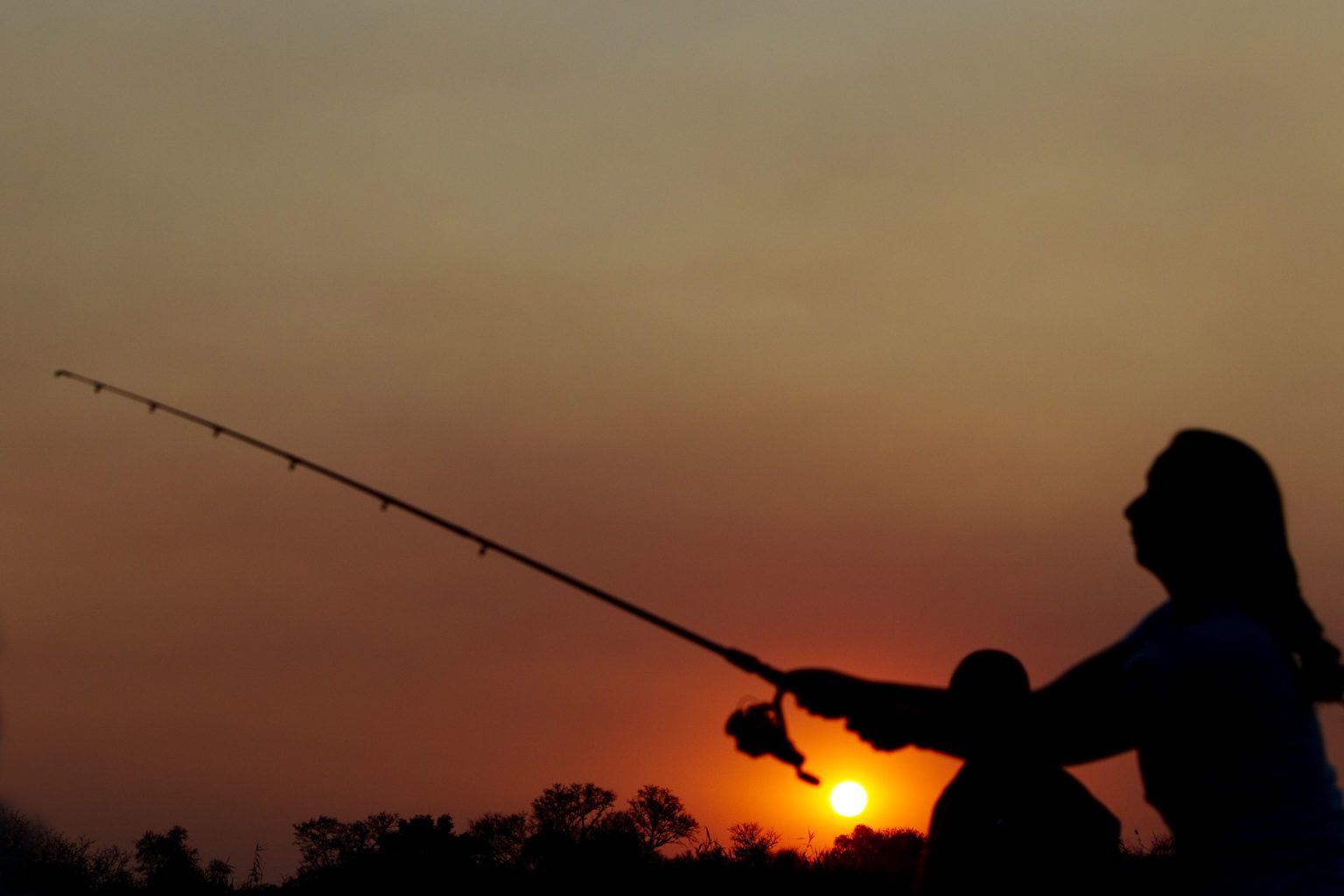 While on our Botswana safari try your hand at Okavango Delta fishing at sunrise