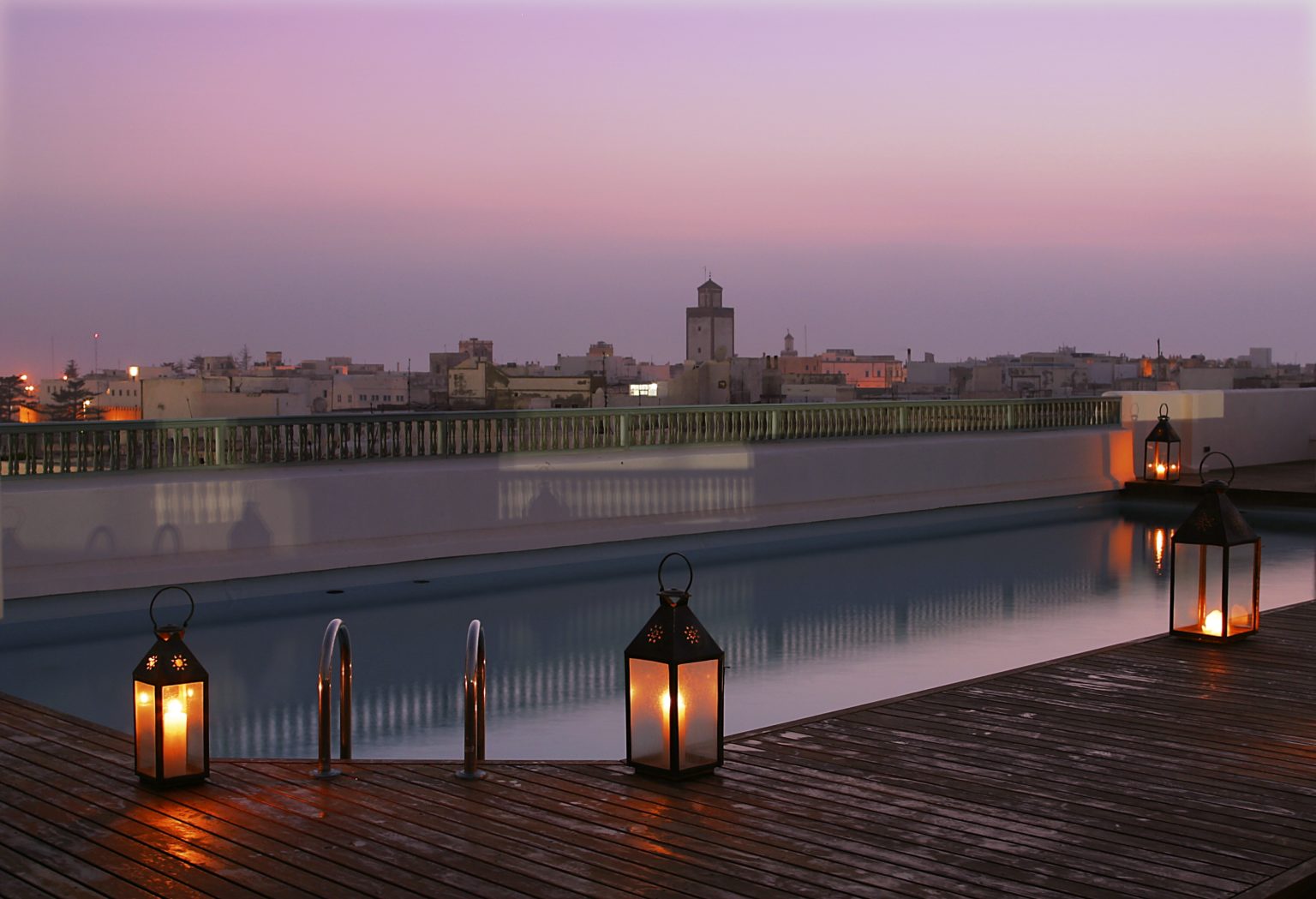 Rooftop pool at sunset at Heure Bleue Palais