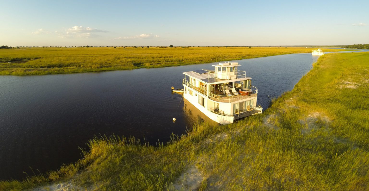 Chobe Princess river cruise stopped along the grassy banks