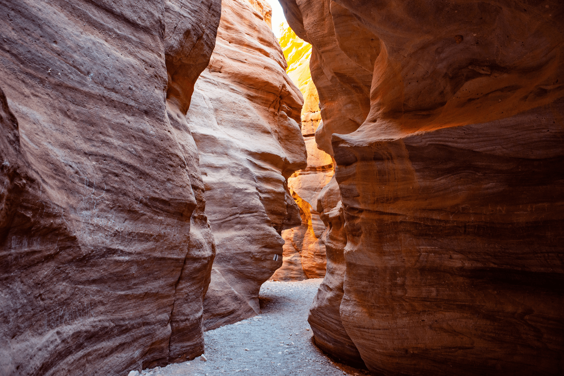 A narrow slot in the side of a canyon.