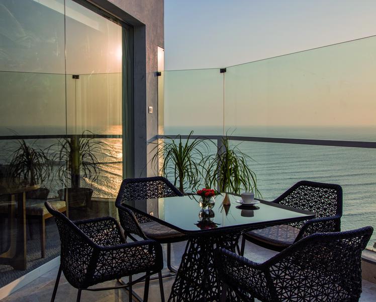 Table on hotel patio overlooking the ocean