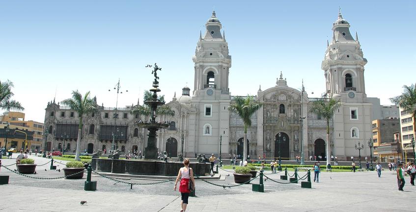 Government building with a woman walking past in Lima