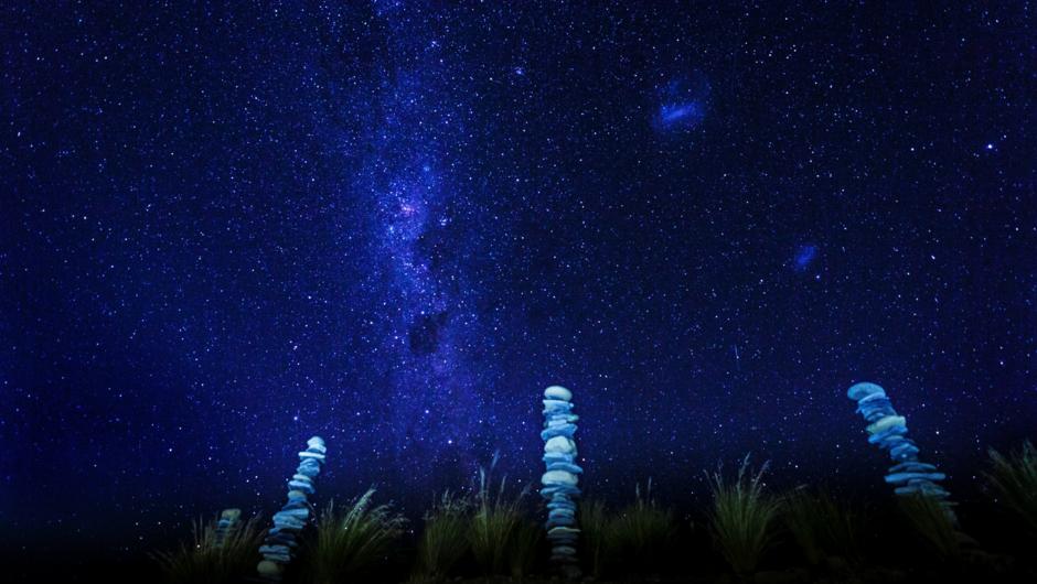 stacked rocks beneath the milky way in the southern sky