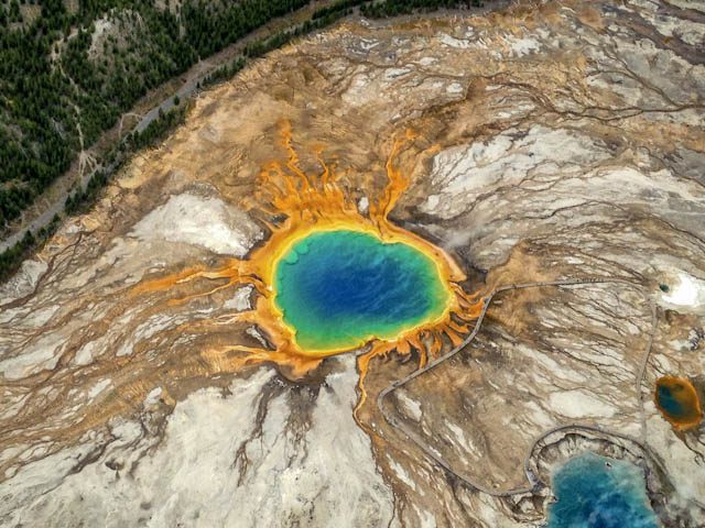 multicolored water on a rock in yellowstone