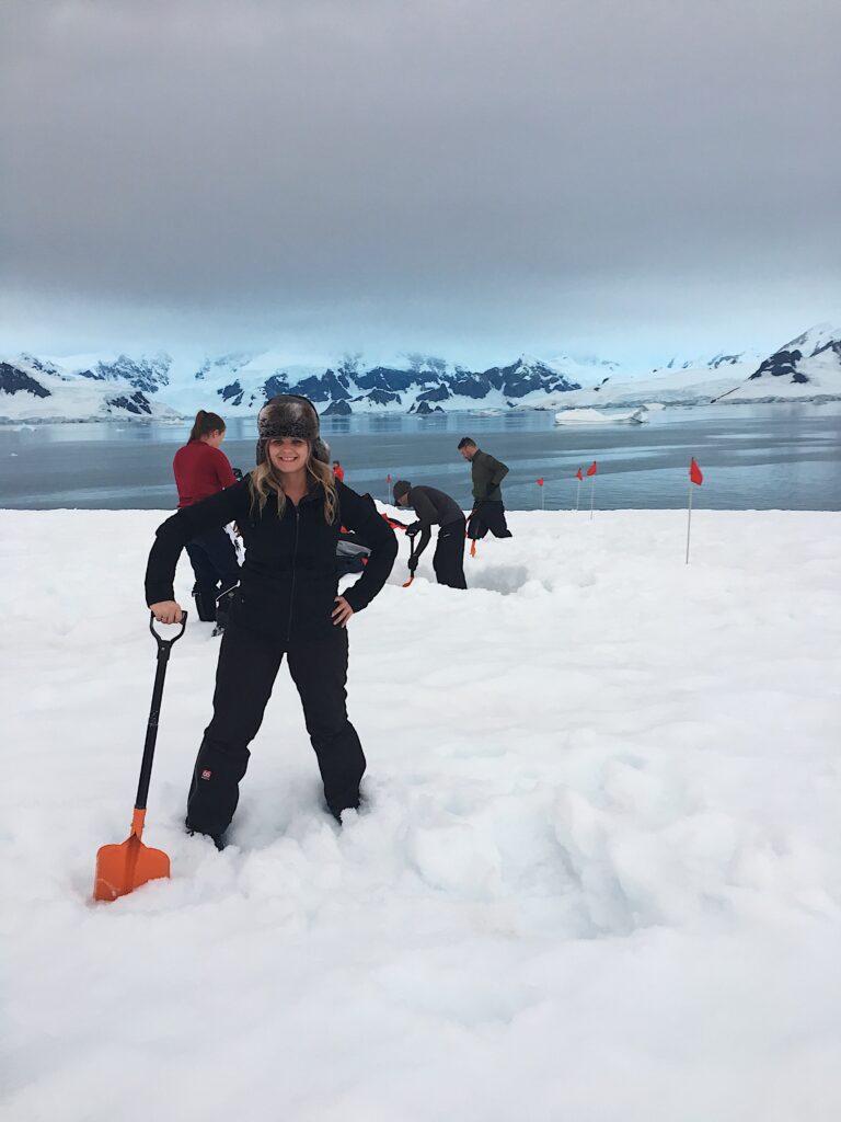 Our content manager, Alicia-Rae Light, digging her hole to camp in on the Antarctic Peninsula.
