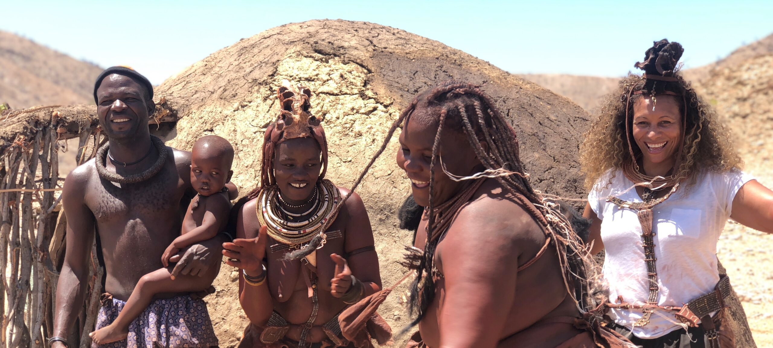 Woman dancing in celebrating with few Himba people in the Kaokoland region