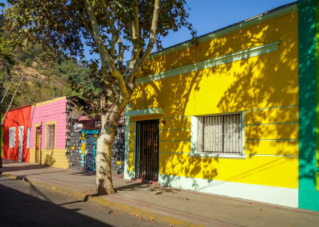 Sunlight hitting a colorful row of houses in the Bellavista neighborhood of Santiago Chile. 