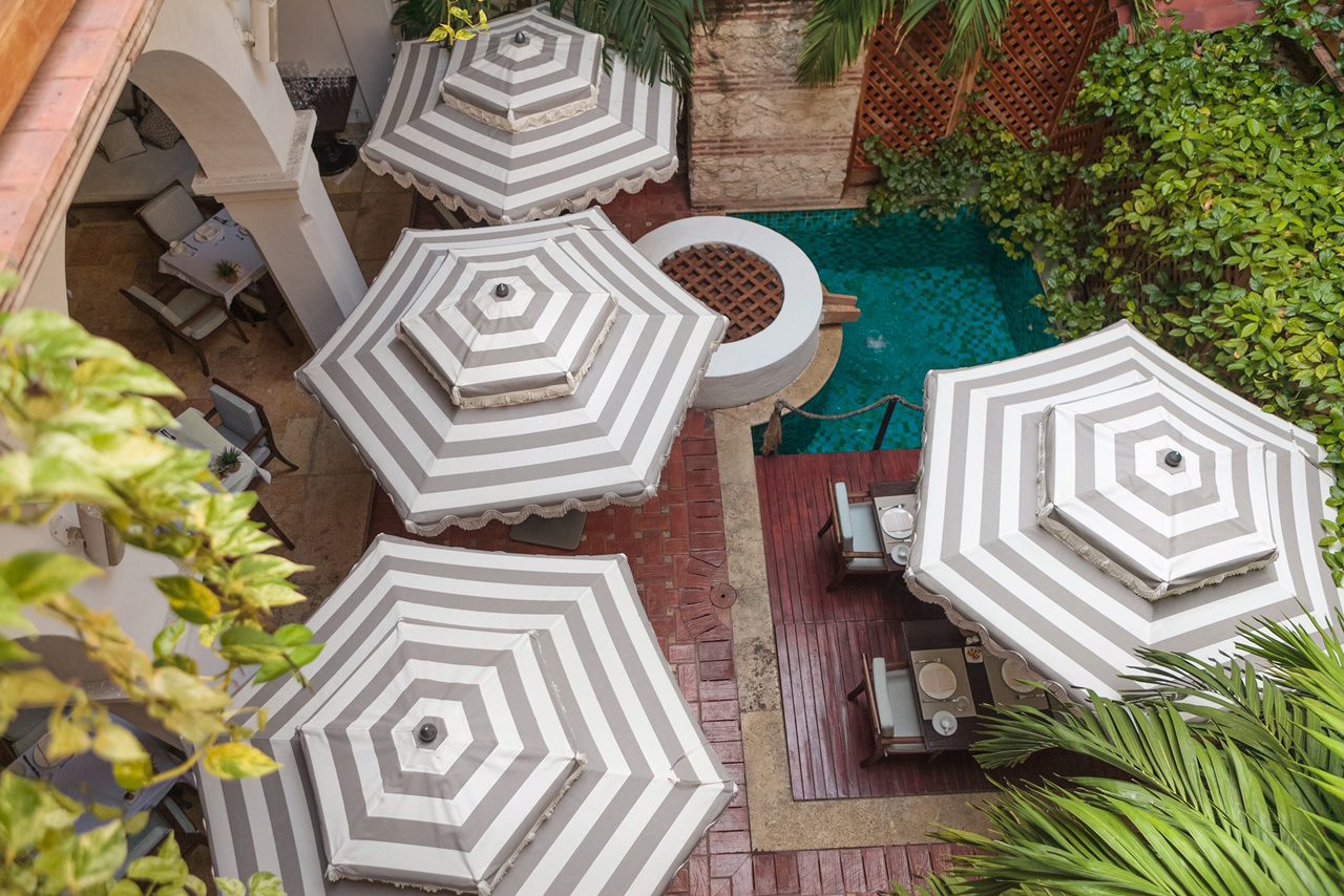 an overhead view of a patio with umbrellas.