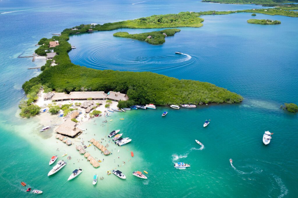 Arial view of Isla  Cholón with boat docked and scattered around the beach area