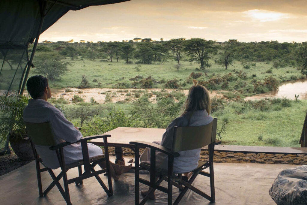 two people looks at richards river in kenya