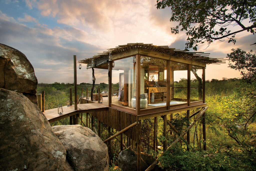 Accessed by a small drawbridge, the wood-and-glass Kingston Treehouse at Lion Sands offers a luxury safari adventure escape.