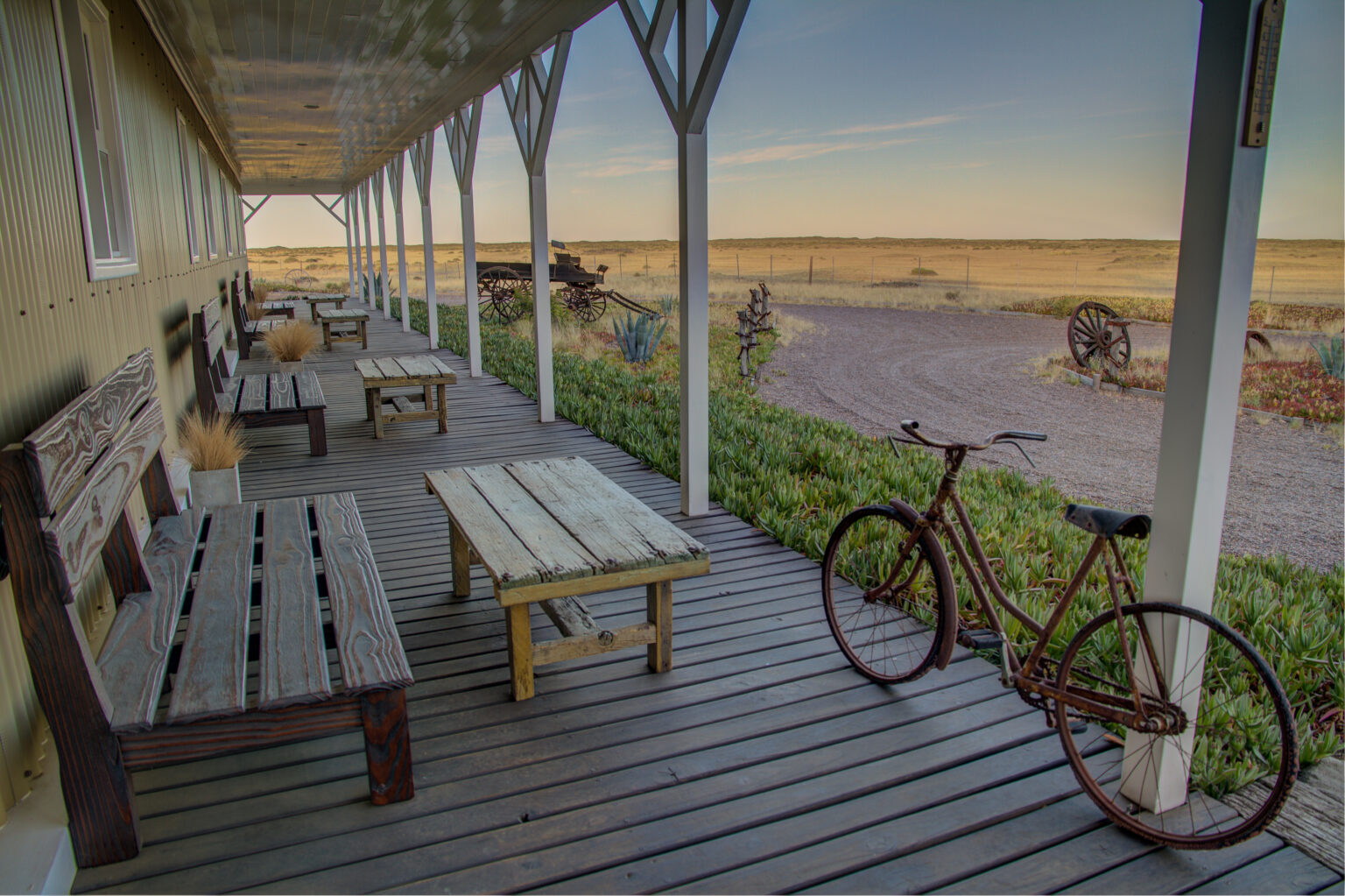 Benches and bicycles on a deck overlooking plains
