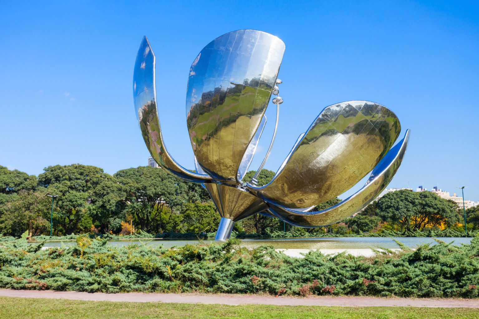 Metallic sculpture of flower in city park