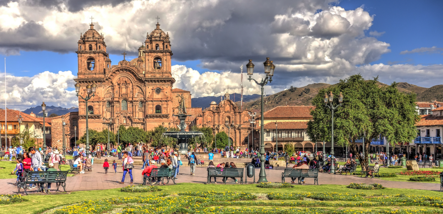 City square with colonial church and mountains
