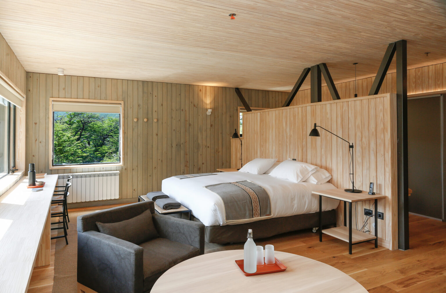 Bed in room with wooden walls