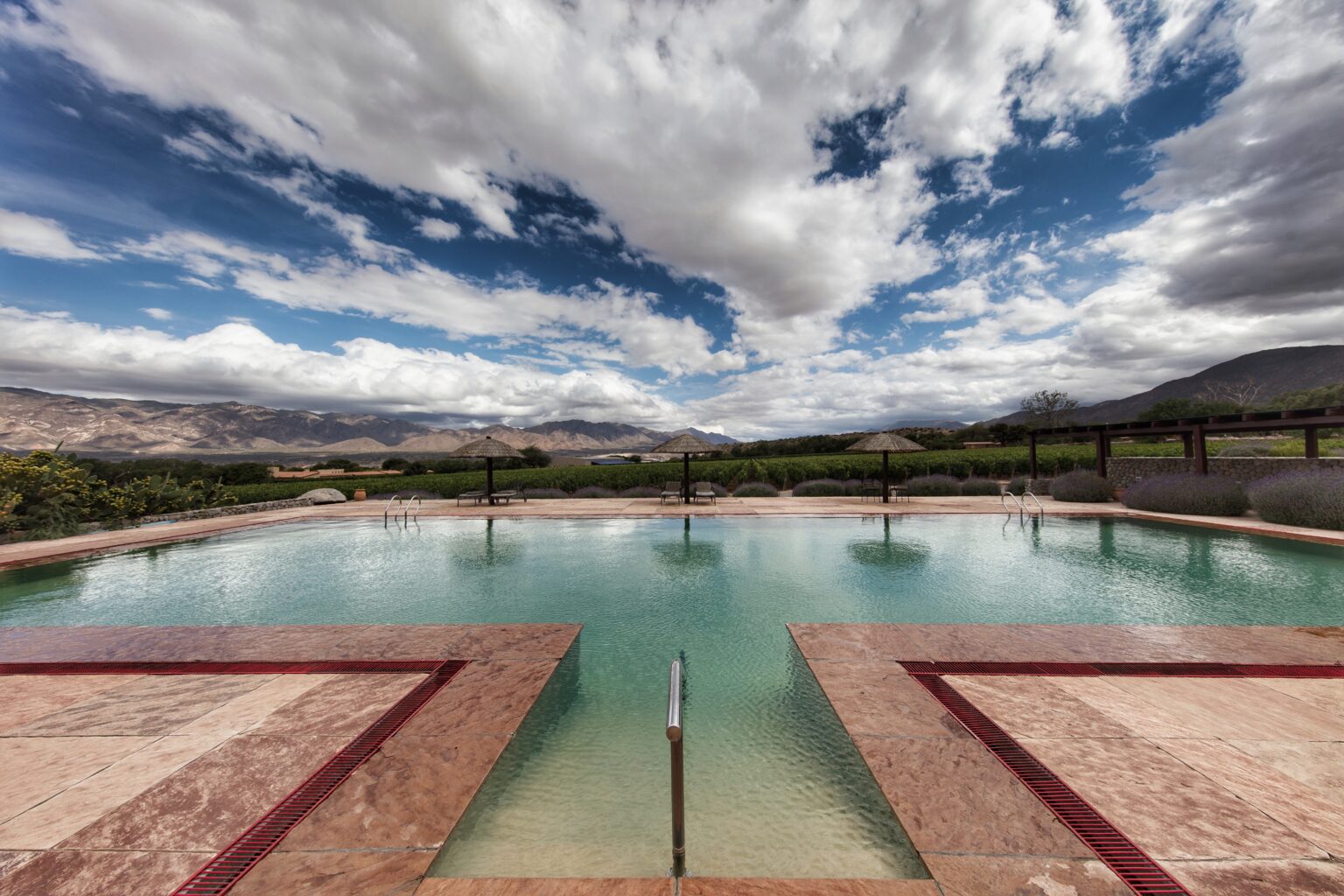 Swimming pool overlooking desert landscape