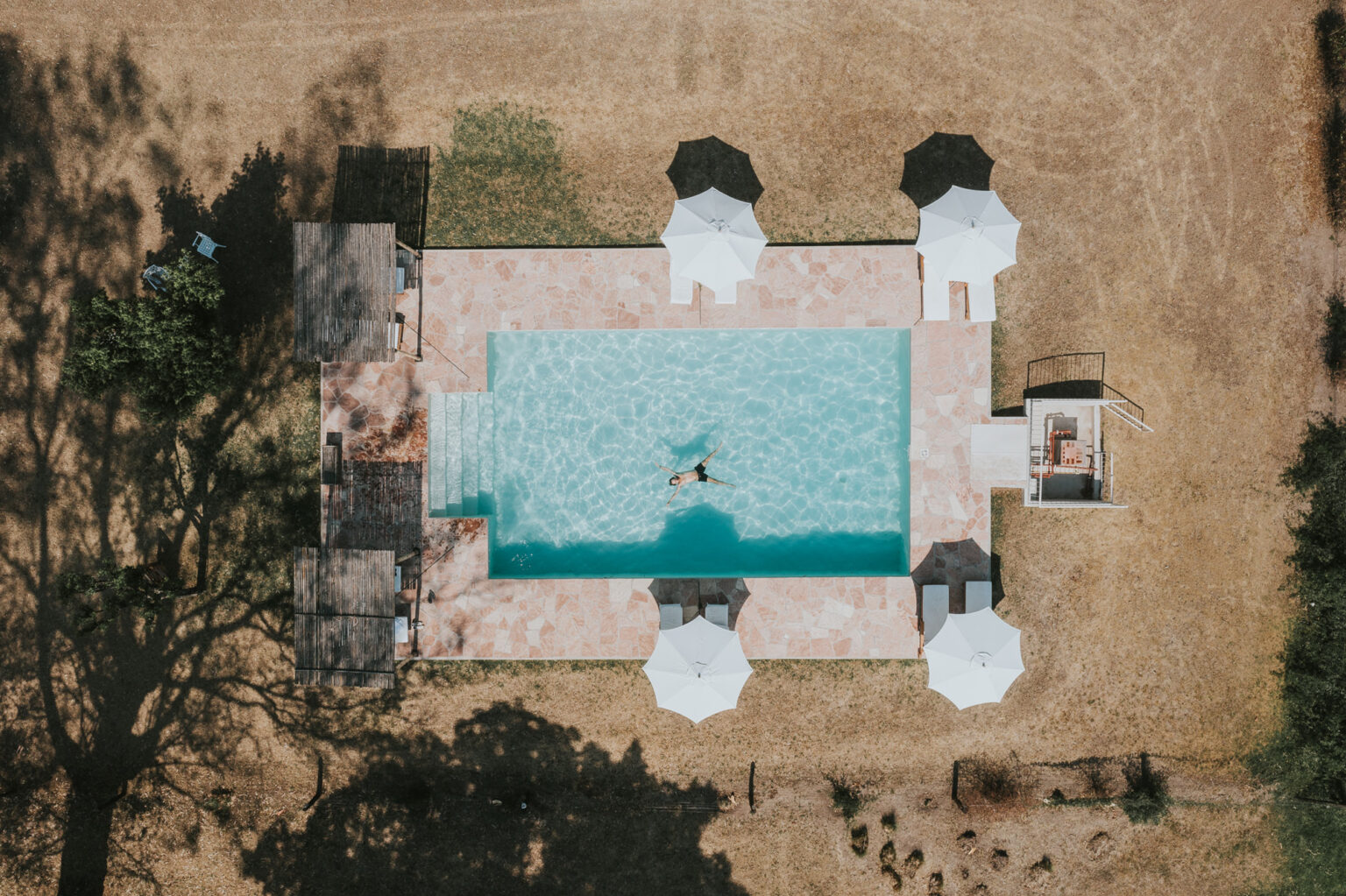 Areal view of hotel pool with umbrellas