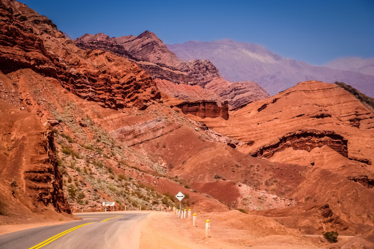 Red desert mountains with road