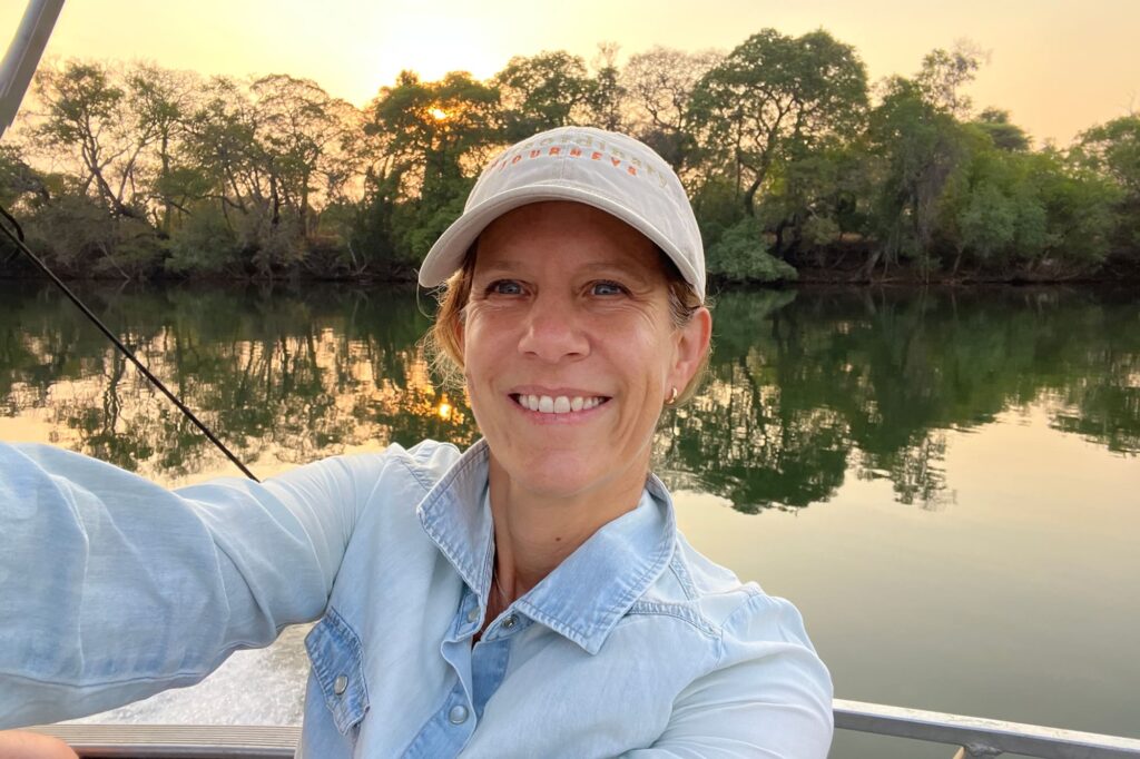 Senior Safari Specialist Lara on a boat in Zambia.