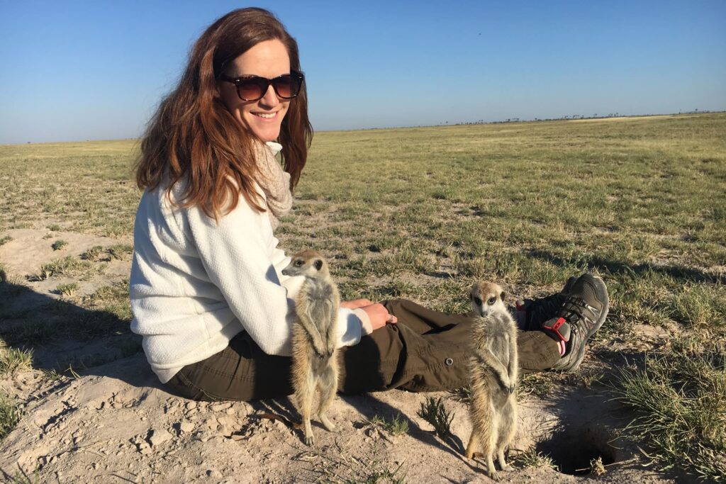 Safari specialist Kim Green and a pair of meerkats in Botswana.