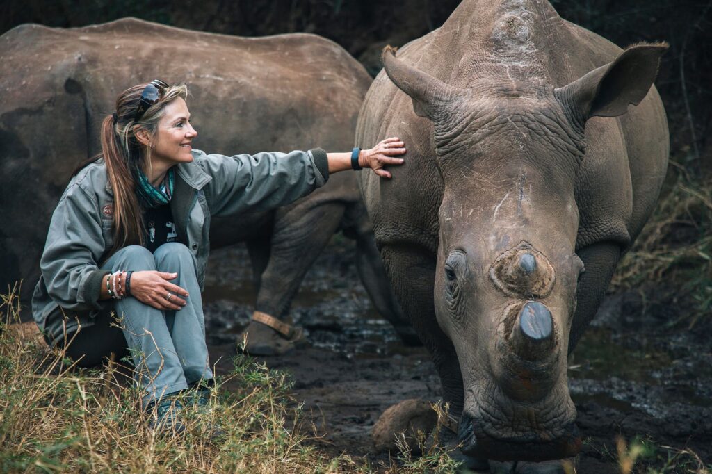 Petronel Nieuwoudt, famed conservationist, with rhinos in South Africa