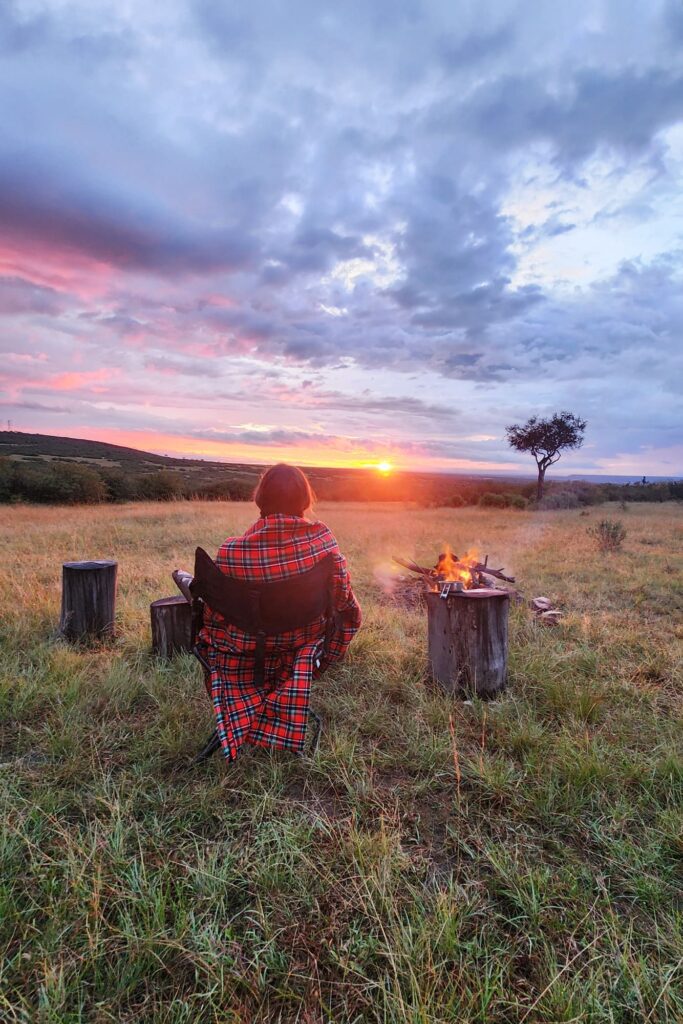 Abby, our safari specialist, watching the sunset from Mara Bushtops, a private concession just outside the Maasai Mara