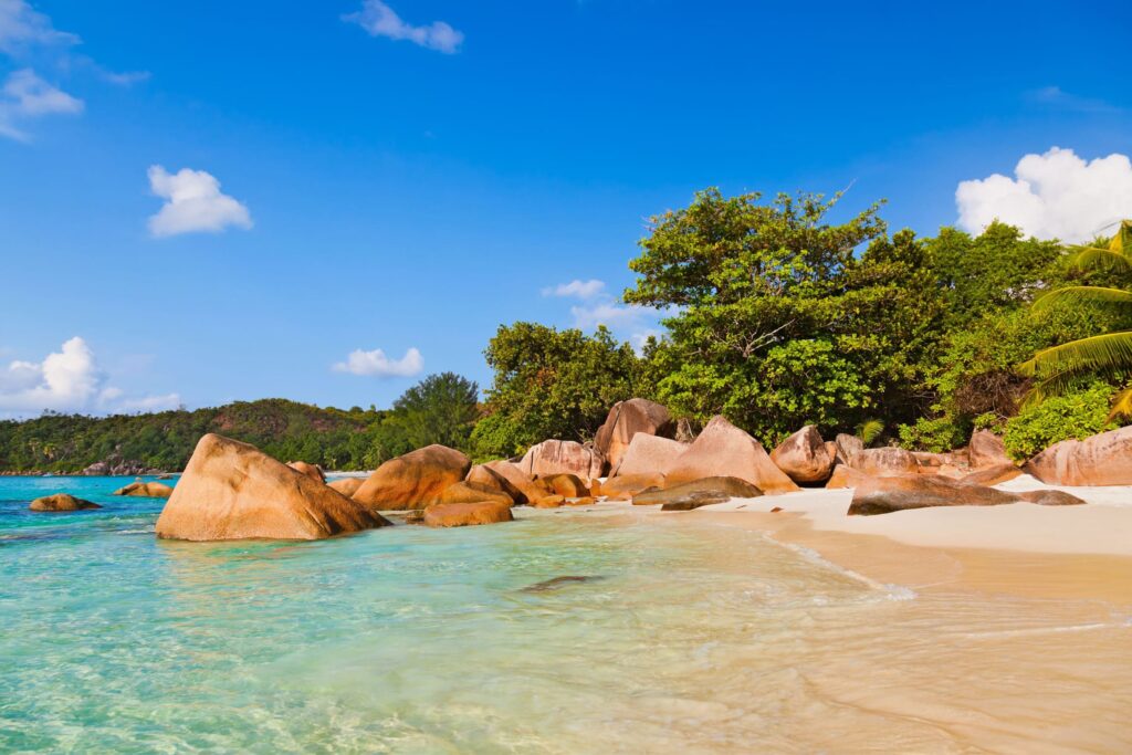 Granite boulders and clear waters at Anse Lazio beach on Praslin, a top destination in our Seychelles travel guide.