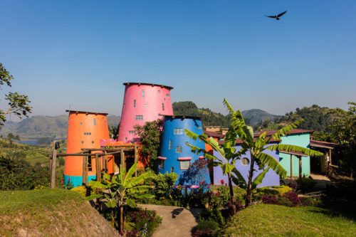 colorful buildings set in the lush forests of southern Bwindi Impenetrable Forest Uganda