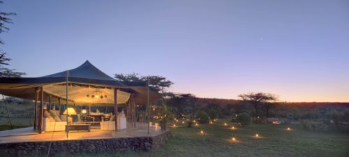 Richard's River Camp dining tent exterior lit by lantern at night